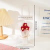 A clear cellophane bag tied with twine containing a handmade crochet flower bouquet for special occasions