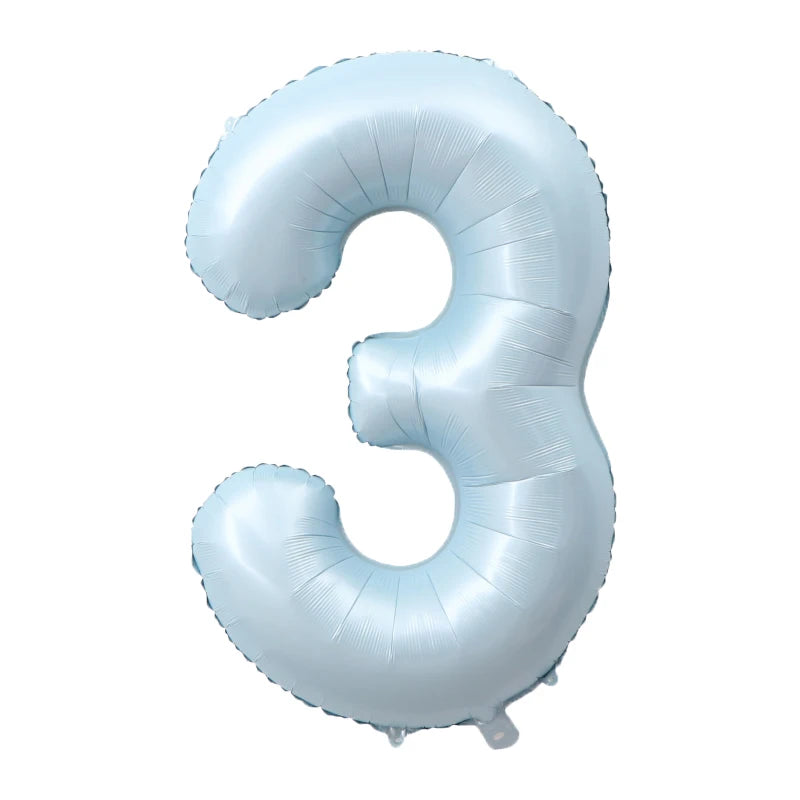 A light blue foil number balloon shaped like the number three.