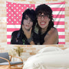 A wall hanging featuring a portrait of Jake Webber and Johnnie Guilbert set against an American flag background.