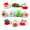 Un juego de lindos imanes navideños con Santa, un árbol de Navidad y una casa de jengibre.