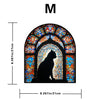 A stained glass window featuring a silhouette of a black cat in an arched frame.
