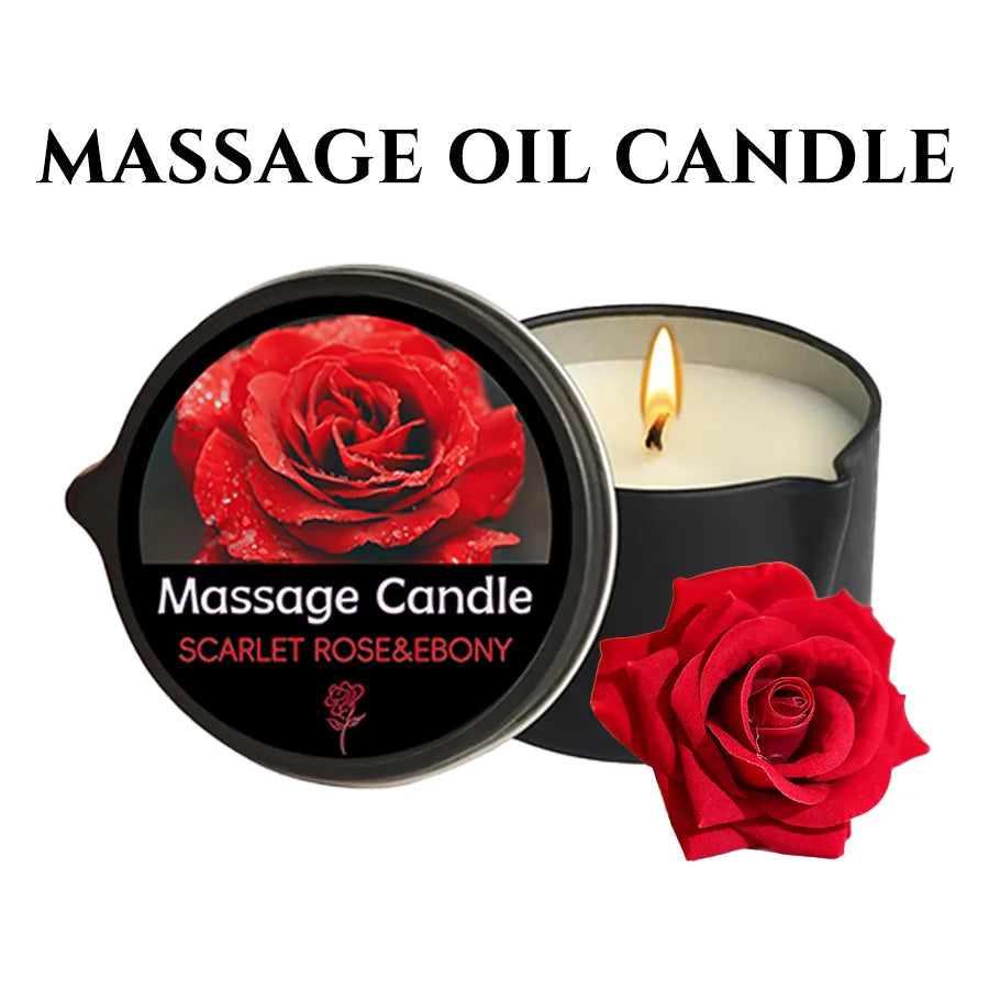 A dark jar candle with a red rose design and a lit wick, labeled as a Massage Candle Scarlet Rose & Ebony.