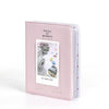 A pink 64-pocket photo album for instant cameras with a clear window display.