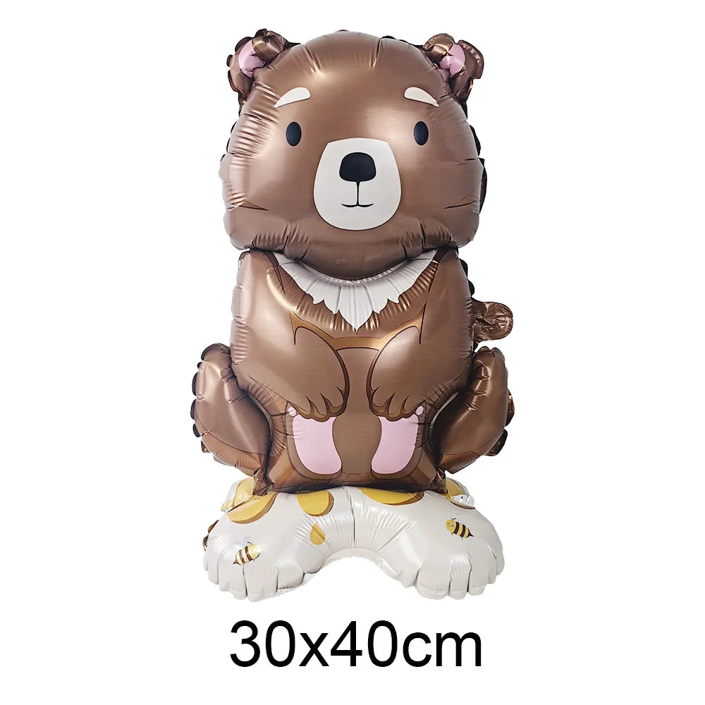 A realistic brown bear foil balloon decoration with white accents and a white base.