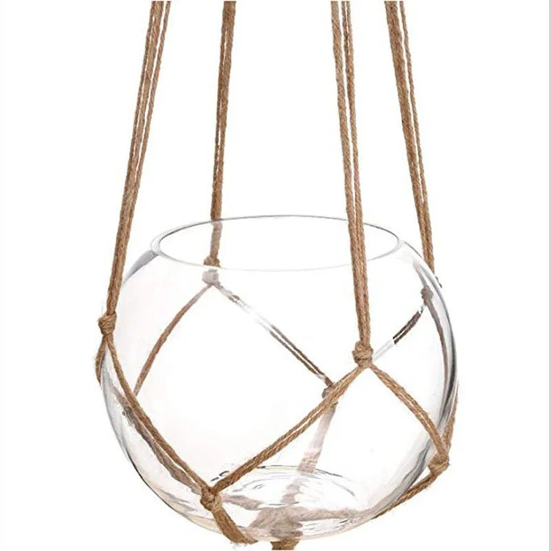 Handmade macrame plant hanger with a clear glass bowl suspended by natural cotton rope.