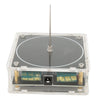 A clear plastic box containing an arc plasma music coil for educational experiments with a central metal rod.