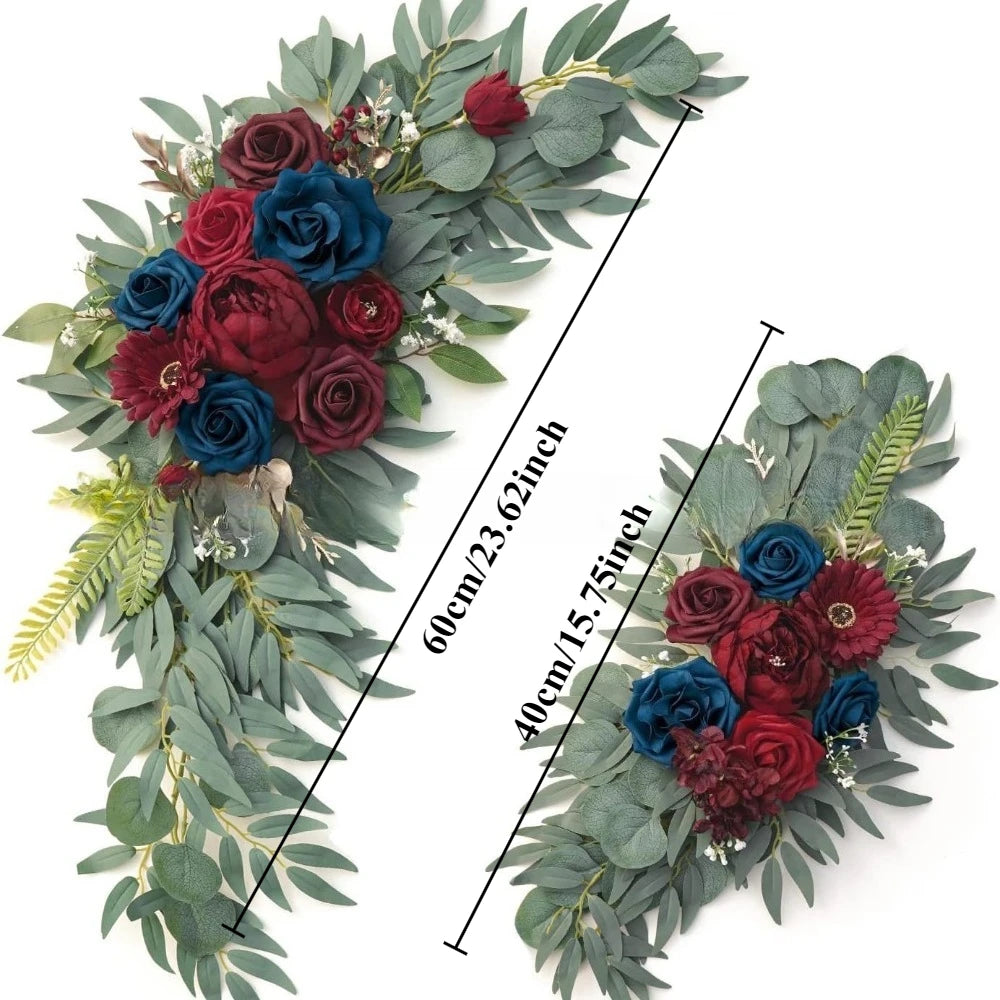 A floral kit featuring deep red and blue roses accented with dusty rose and blue eucalyptus greenery.