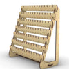 A wooden earring organizer with multiple slots for displaying jewelry.