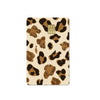 A card cover featuring a repeating pattern of brown and gold leopard print stickers.