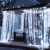Blue fairy curtain string lights draped over a window for indoor and outdoor decor.