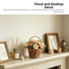 A woven rattan basket filled with dried flowers and greenery displayed on a mantelpiece.