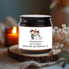 A glass jar candle with a label featuring the names Daniel & Canla and the date 12.12.2025