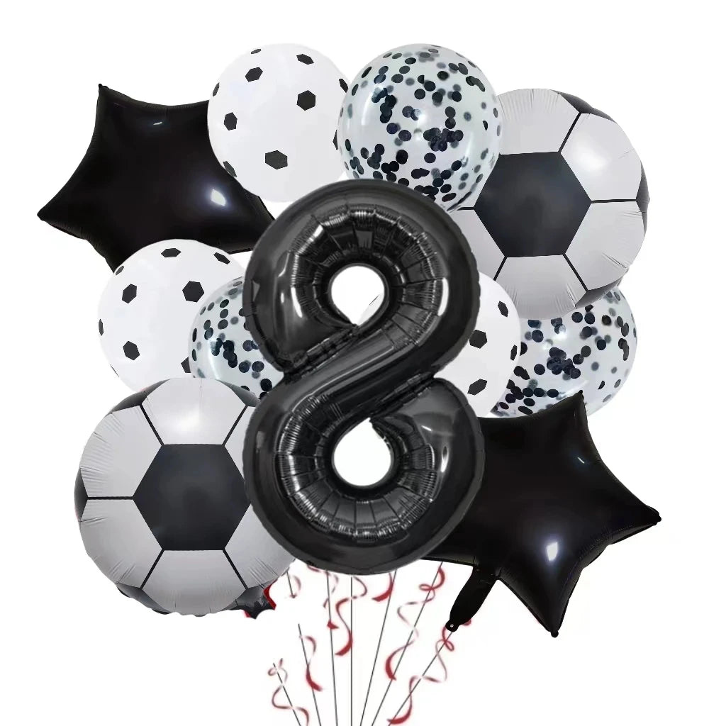 A collection of black and white football-shaped helium foil balloons for birthday party decorations.