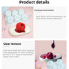 A set of white silicone molds for raspberry mousse desserts, showing a molded red raspberry and several finished dessert shap