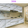 Modern kitchen cabinets with white marble contact paper featuring stainless steel accents and a sleek countertop.