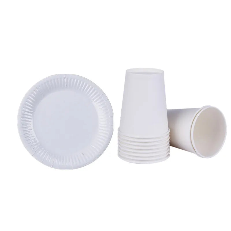 A set of white disposable tableware including a plate and several cups.