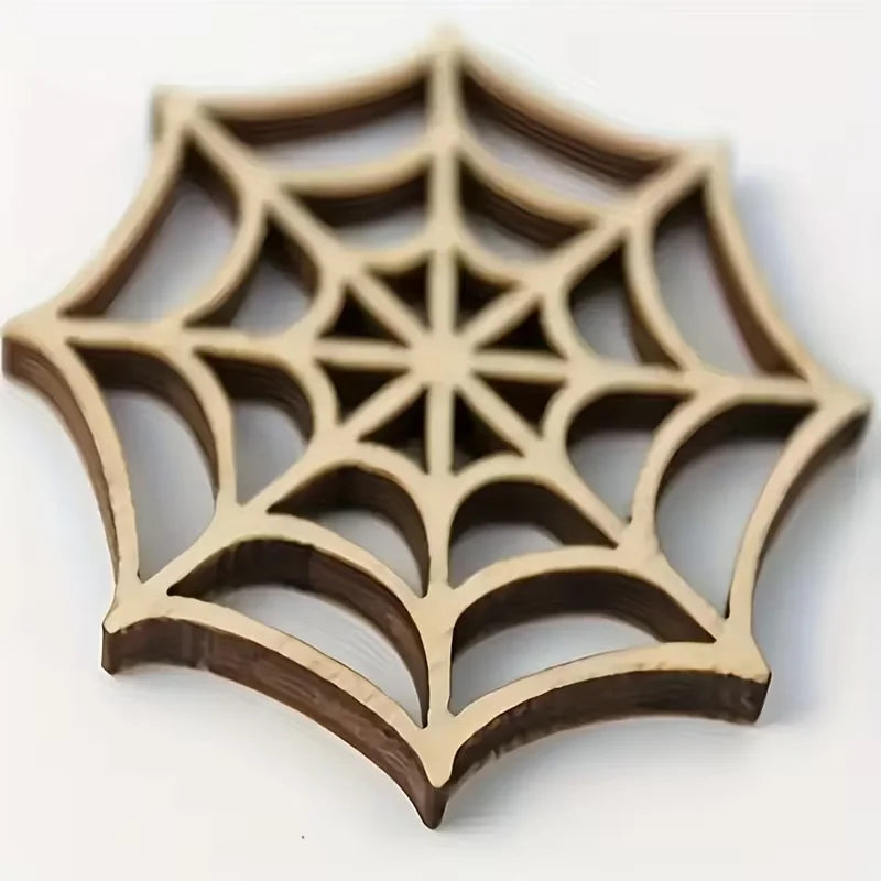 A wooden spider web ornament with a starburst design carved into a decorative shape.