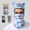 A man wearing a blue and white tiger print ski balaclava with cat ears.