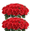 A dense bouquet of vibrant red artificial silk roses.