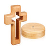 A light wood crucifix wall ornament with a cross shape and a round base.