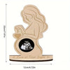 A wooden ultrasound photo frame featuring a silhouette of a pregnant woman and a heart, with the text Love at First Sight.
