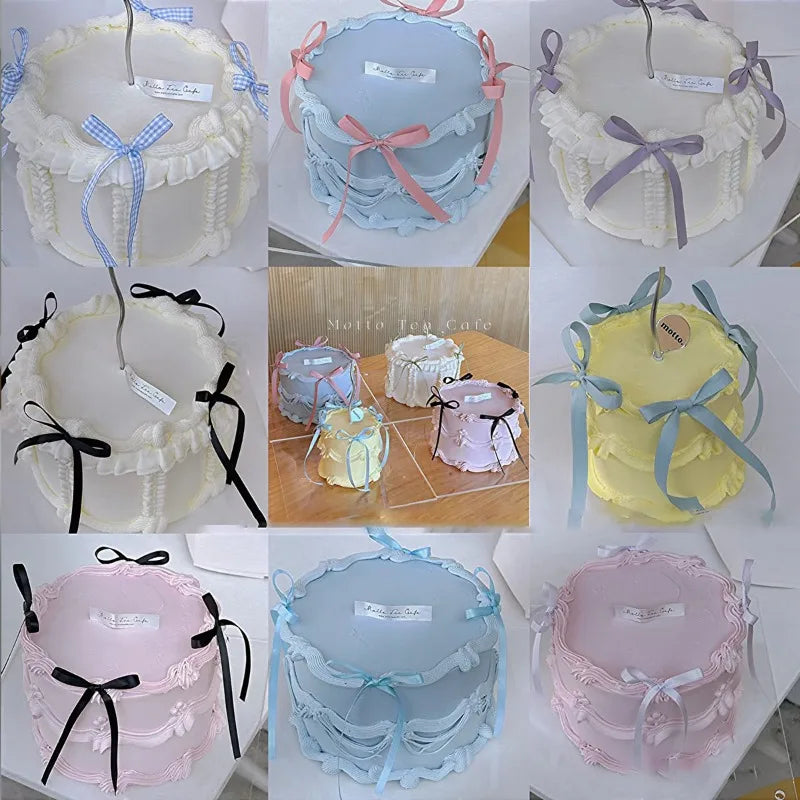 A set of pink and blue bowknot ribbon cake toppers for birthday and wedding cakes.