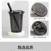 Various black disposable U-shaped coffee cups and lids shown in different finishes