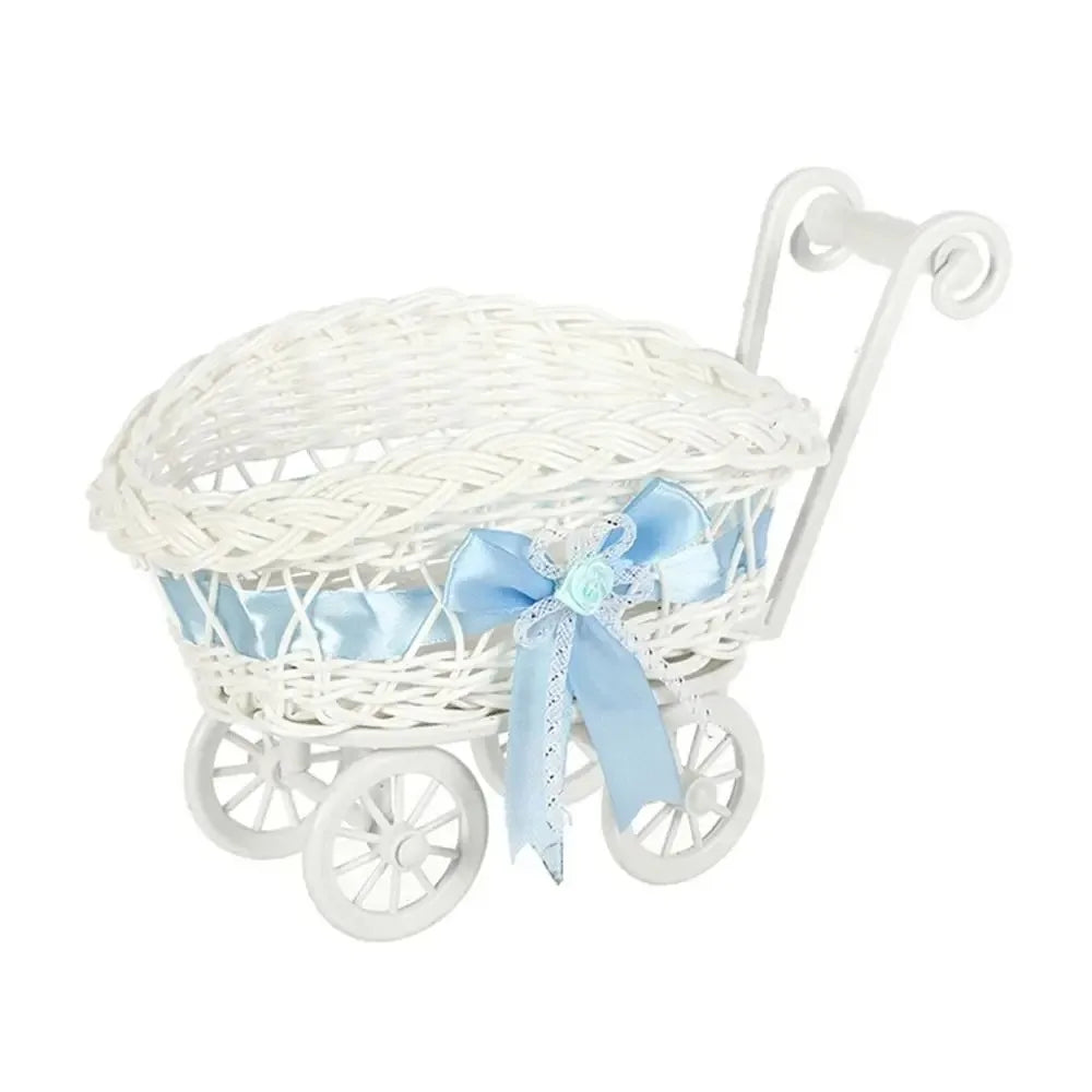 White faux rattan woven storage basket with a light blue ribbon bow and handle