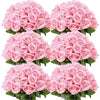 A bouquet of pink artificial silk roses arranged for table decor.
