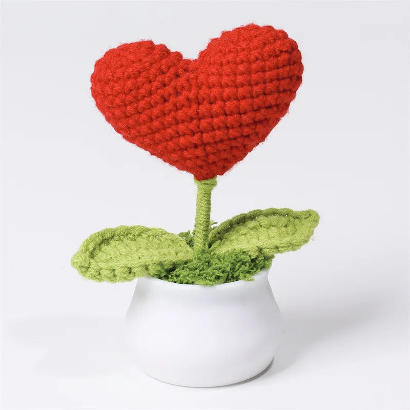 Hand woven red heart flower in a green pot