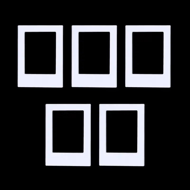 A set of five white rectangular photo frame magnets arranged in a row and a row below.