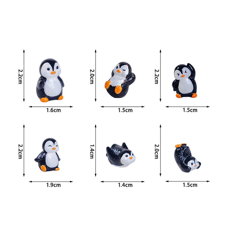 A set of cute cartoon penguin resin figurines in black and white for fairy garden or Christmas decor.
