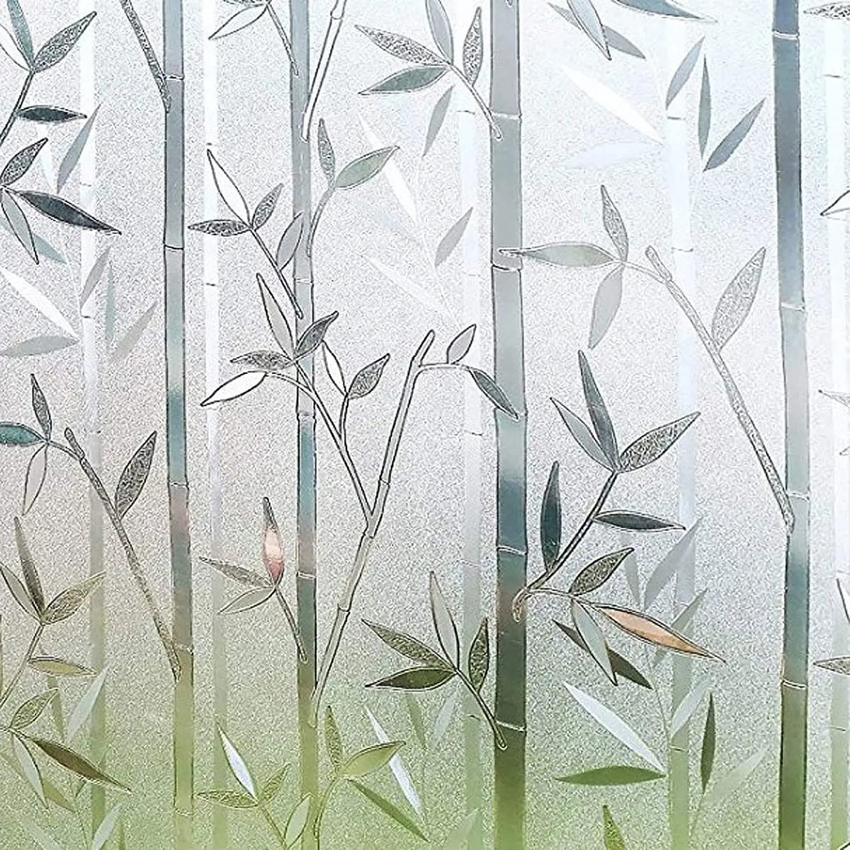 Frosted window privacy film featuring delicate green leaves and vertical light patterns.