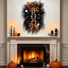 Halloween BOO wreath with pumpkin garland door hanging displayed on a fireplace mantel.