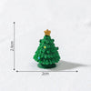 A small, green, textured Christmas tree charm with a gold star topper, shown against a white background.