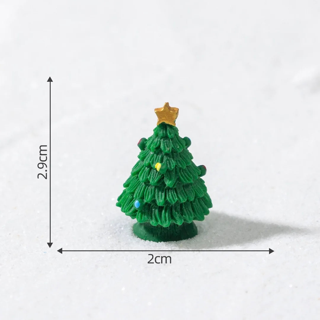 A small, green, textured Christmas tree charm with a gold star topper, shown against a white background.