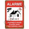 Red vintage metal sign warning about private property under 24-hour video surveillance.