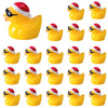 A set of glow-in-the-dark Christmas duck figurines wearing Santa hats.