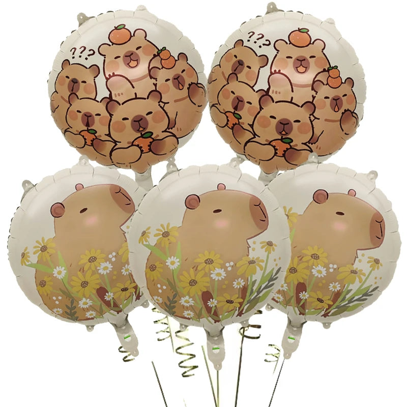 A set of cartoon capybara foil balloons in shades of brown and orange, some featuring question marks.