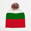 A knitted beanie in the colors of the flag of Russia, featuring a red and green horizontal stripe, with a festive pom-pom on 