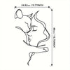 Black line drawing silhouette of a cat embracing a woman's face on a rectangular piece of art