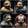 A collection of three horror movie icon duck figurines featuring distinct facial expressions and textures.