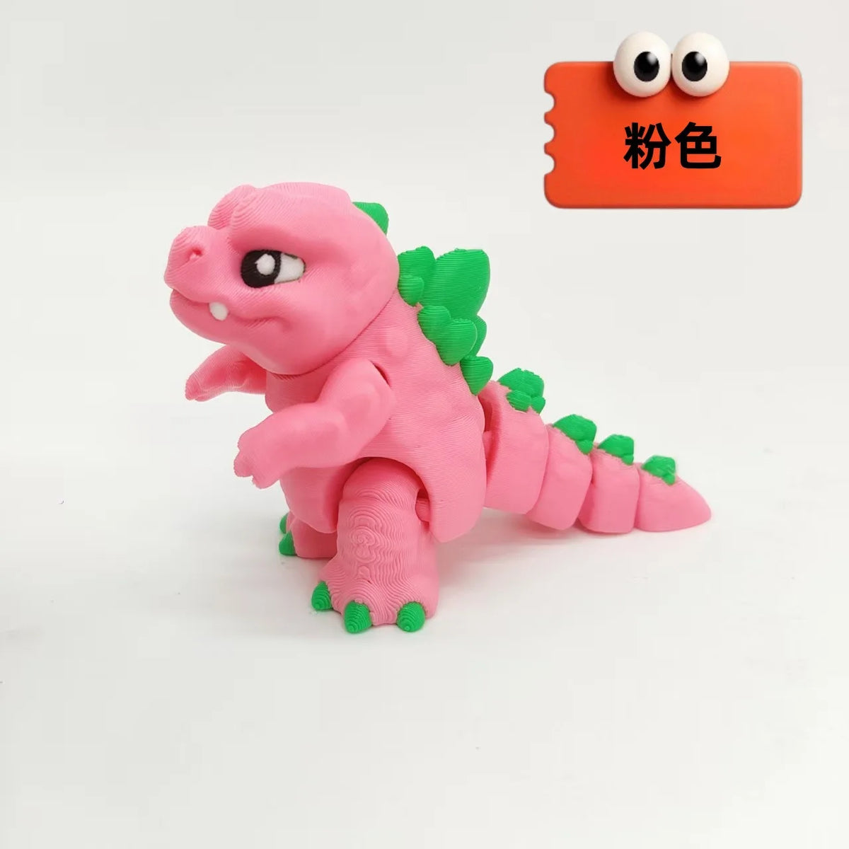 A pink collectible 3D printed Godzilla sitting figure with green accents, shown against a white background.