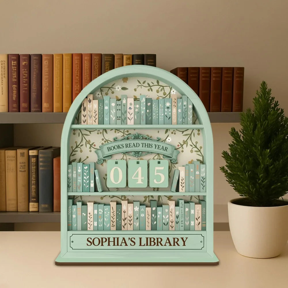 A light blue wooden shelf display featuring a tracker with the number 045 and the text Sophia's Library surrounded by small b