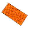 A box filled with numerous orange artificial rose heads used for wedding and party decor.