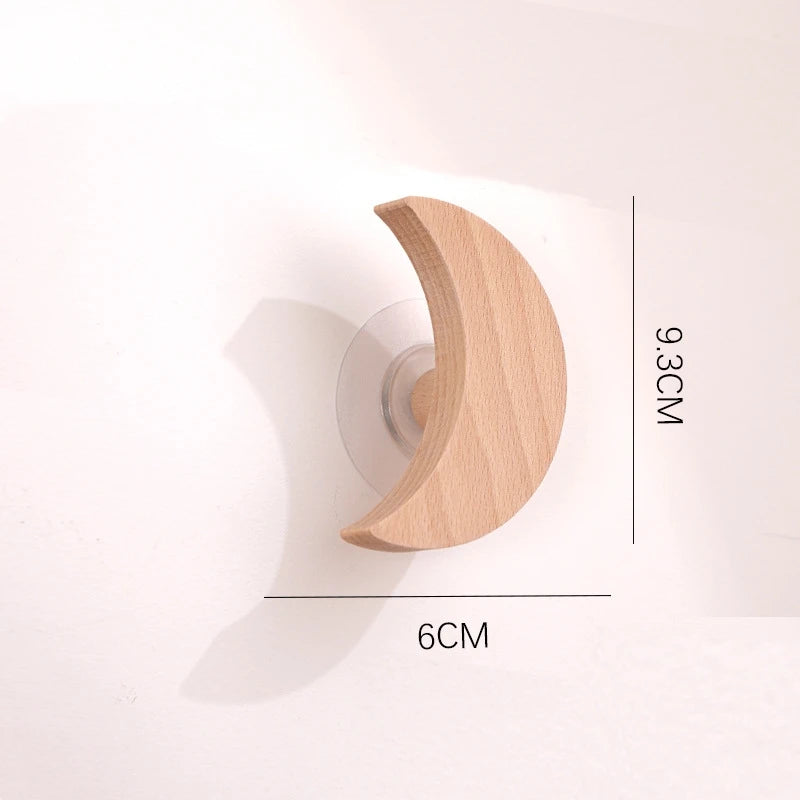 A curved wooden animal hook with a smooth finish shown against a white background.