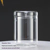 Clear glass cylindrical vase with a lid, used for decorating succulents and moss.