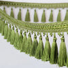 Green decorative tassel fringe trim with gold accents for curtains and DIY projects