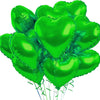 A bunch of bright green heart-shaped foil balloons tied together with string.