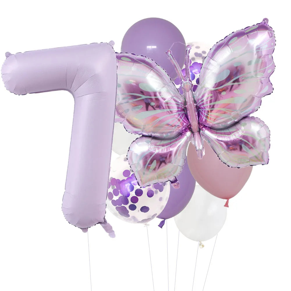 A set of purple foil balloons shaped like the number one and a butterfly
